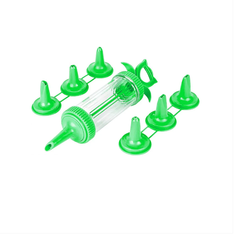 Plastic Icing Tube With 6 Nozzles Attached In Green